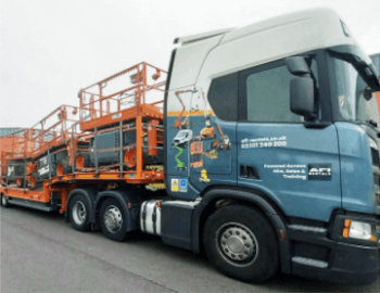 Lorry carrying scissor lifts